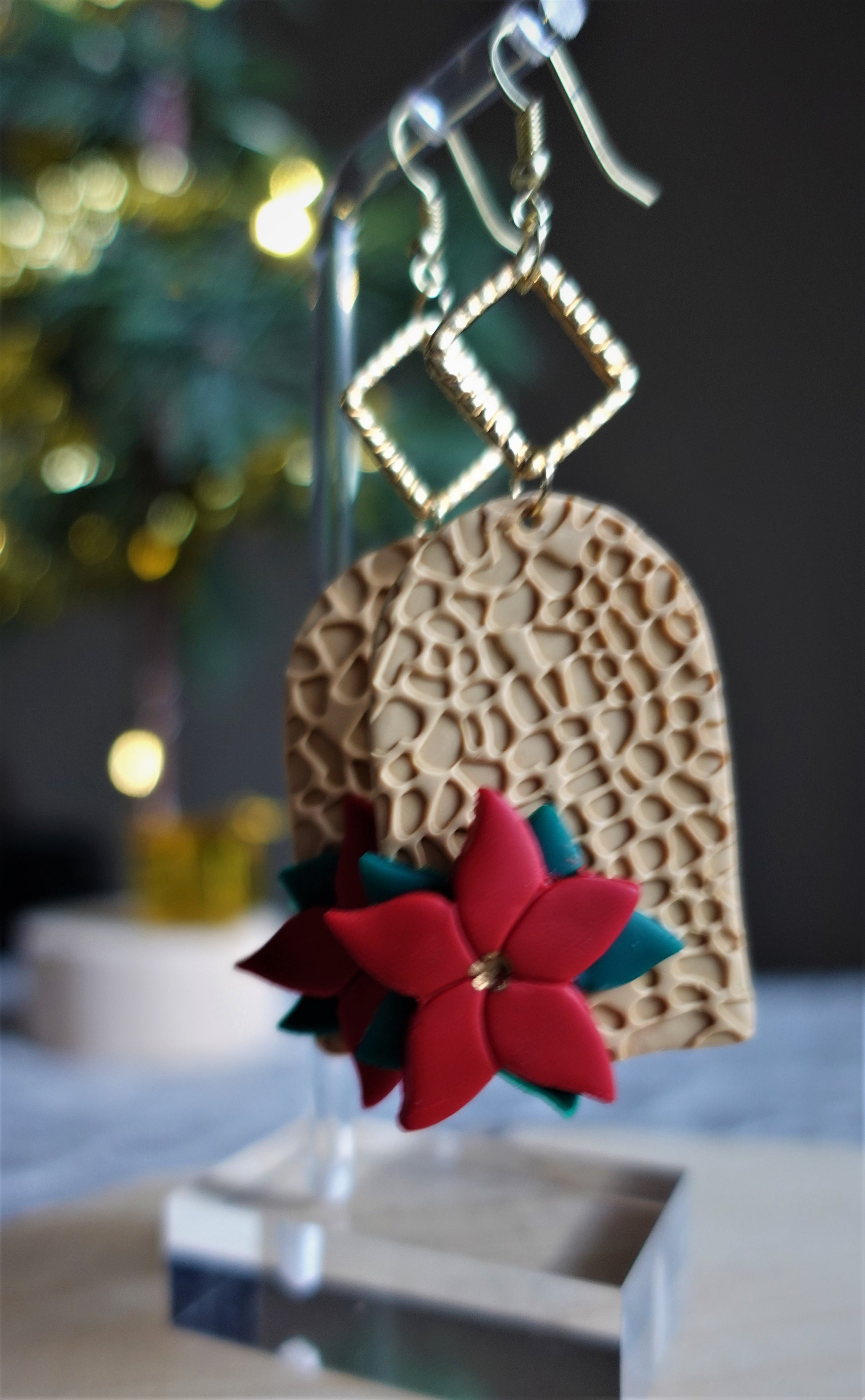 beige earrings with red and green 3d poinsettias and gold components