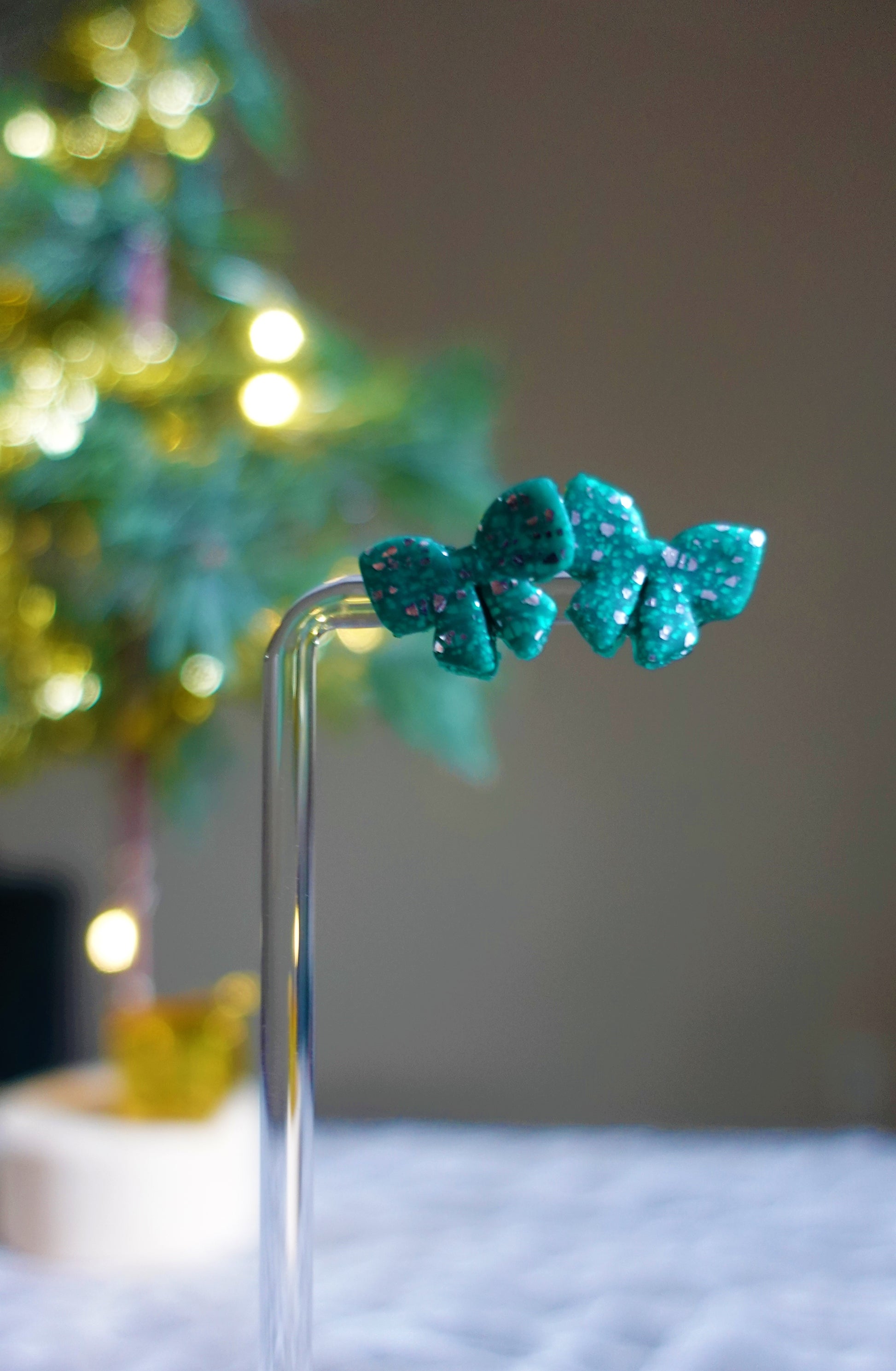 green christmas bow studs with silver glitter