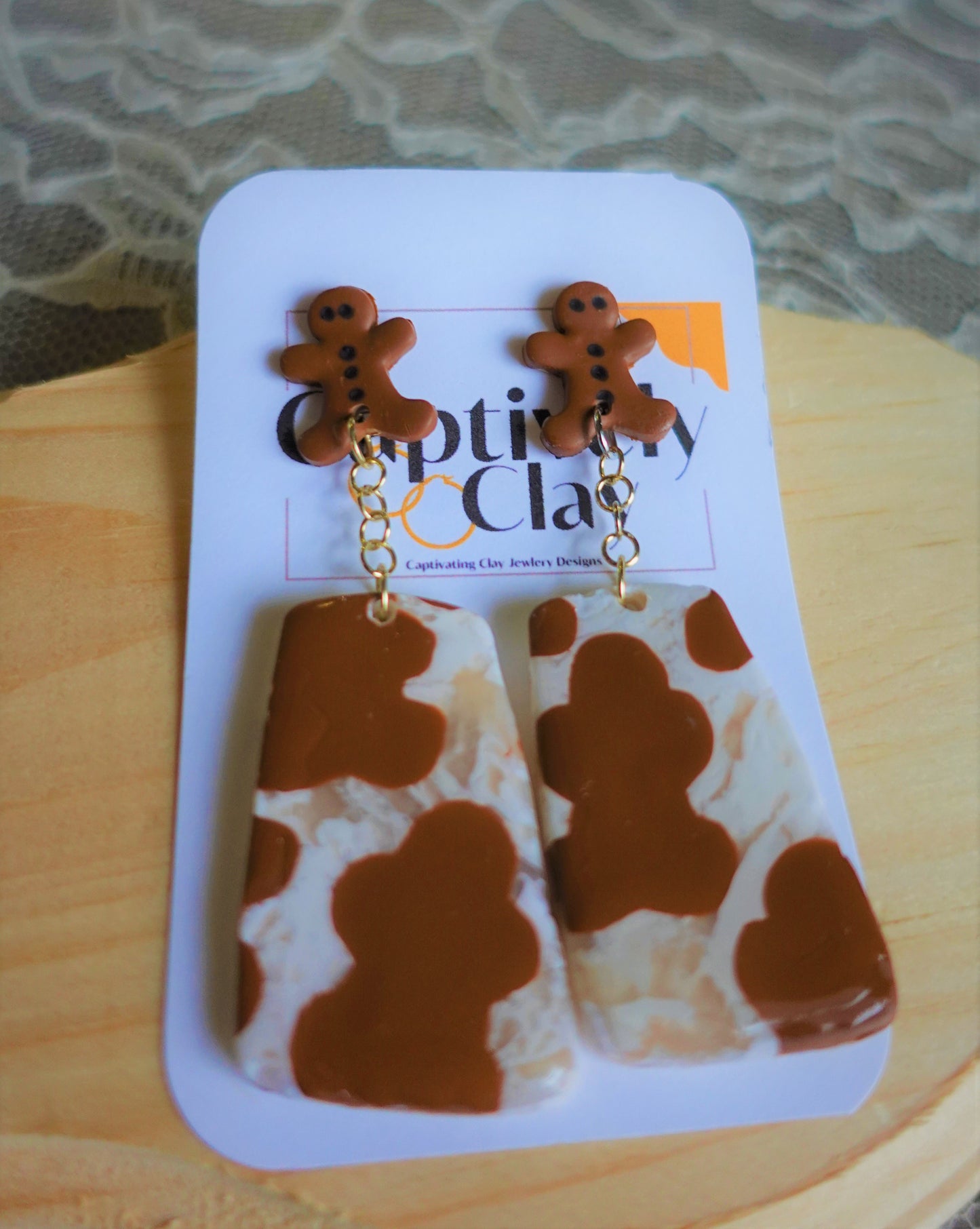 brown and beige gingerbread man dangled earrings